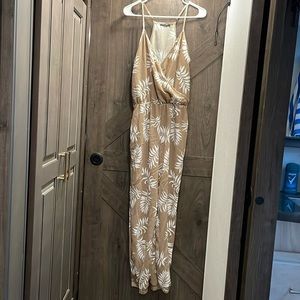A tan fern Jumpsuit/Ramper with no flaws and never worn.